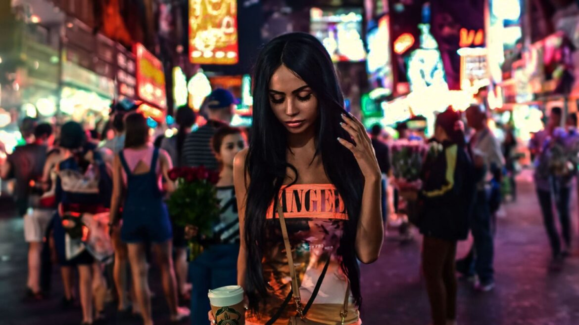 Image of a woman in a vibrant city at night, representing the deep house track "Time" by Faraon & Nowakowski.