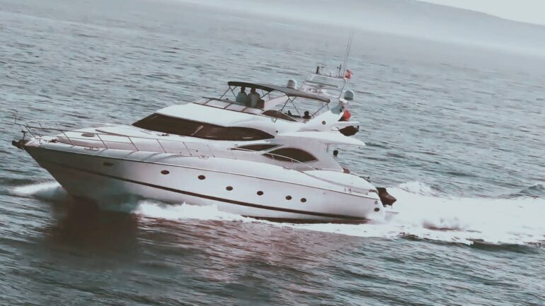 Luxury yacht cruising through the waves with power and speed.