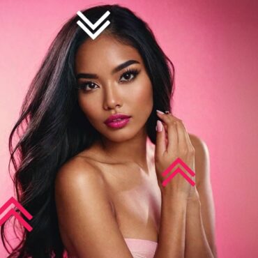 Beautiful Filipina woman posing in pink backdrop.